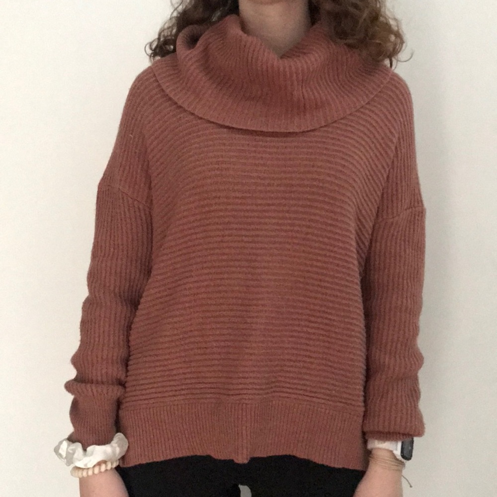 Cow neck sweater with braided detail on the side.